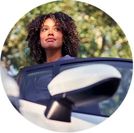 image of a woman getting out of a car