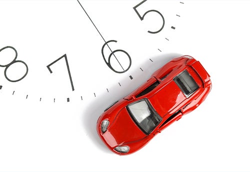 image of a clock and a toy car
