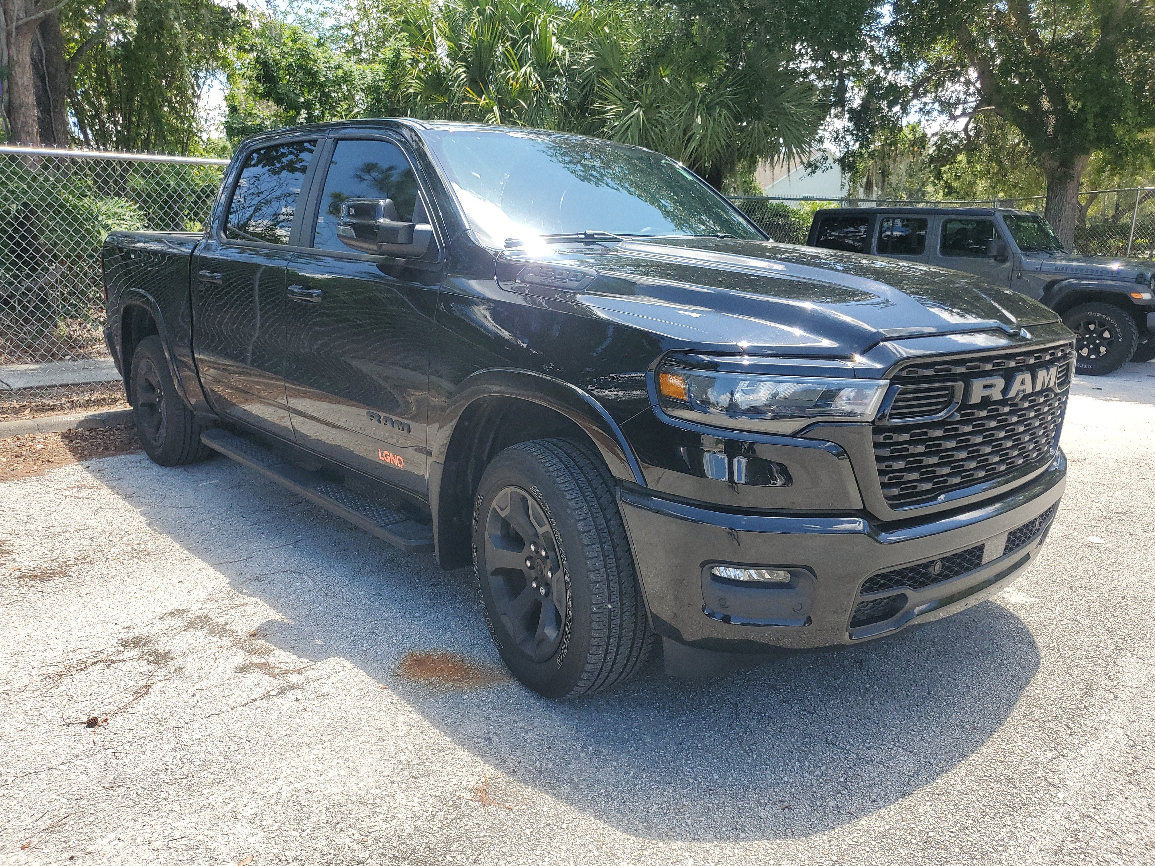 2025 RAM 1500 Big Horn in Diamond Black Crystal Pearlcoat — front three-quarter view