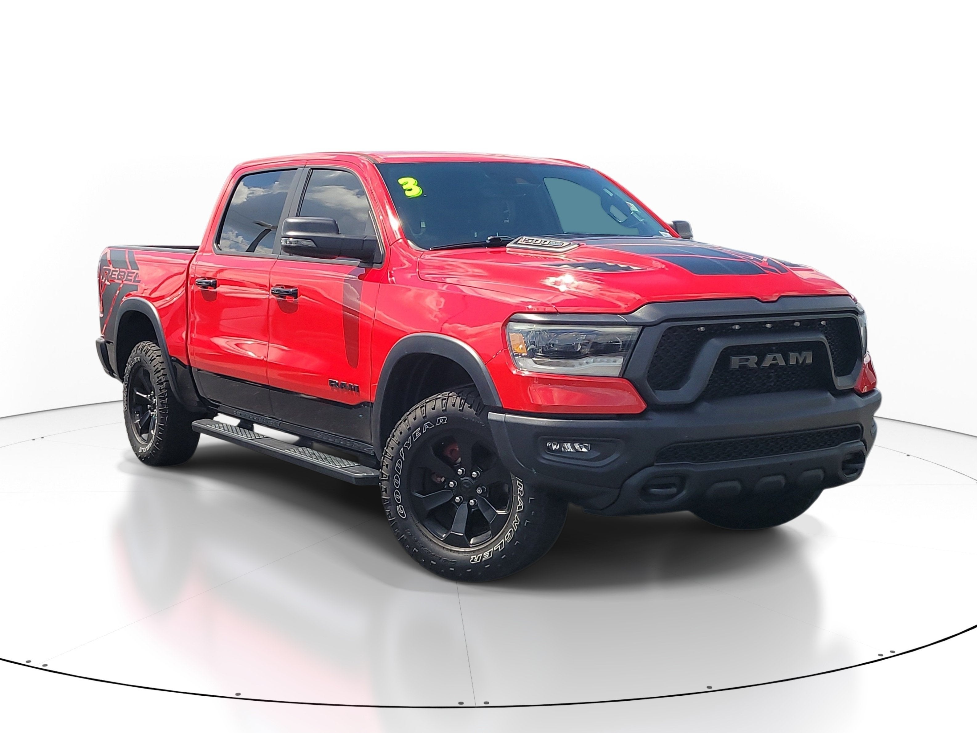 2023 RAM 1500 Rebel in Flame Red Clearcoat — front three-quarter view