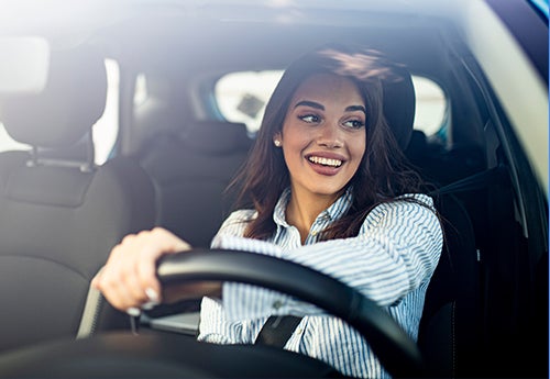 image of a woman driving
